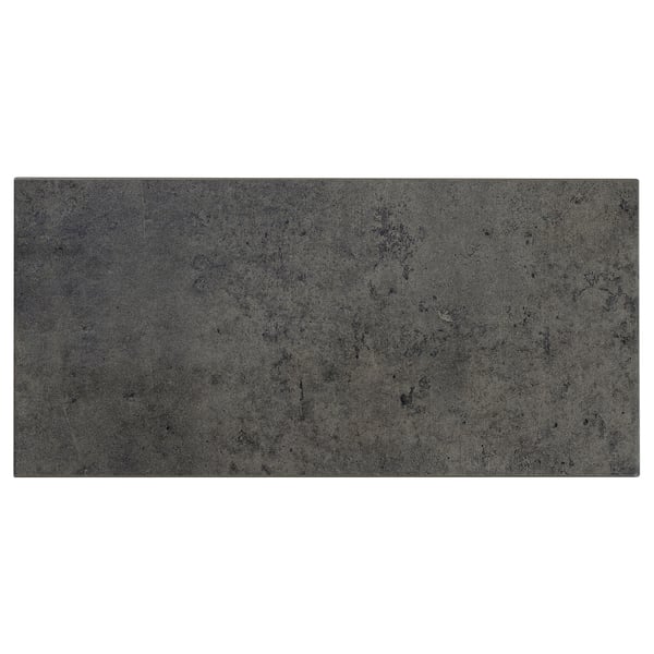 A rectangular, dark grey KALHYTTAN panel with a subtle concrete texture, made from laminate and particleboard, suitable for kitchen use.