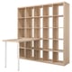 A light wooden KALLAX bookshelf with storage cubes and a desk extension. It has a minimalist and modern design.