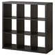 Black KALLAX cube shelf with 9 compartments, recycled particleboard, minimalist design.