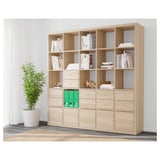 Bookshelf KALLAX: organizes books, stores items in drawers and on shelves, serves as a room divider.