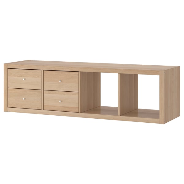 A KALLAX light brown wooden storage unit with four drawers and an open shelf.