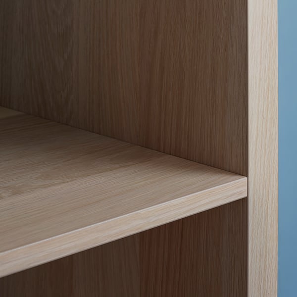Ikea KALLAX wood unit, light brown shelf detail, clean, modern look.