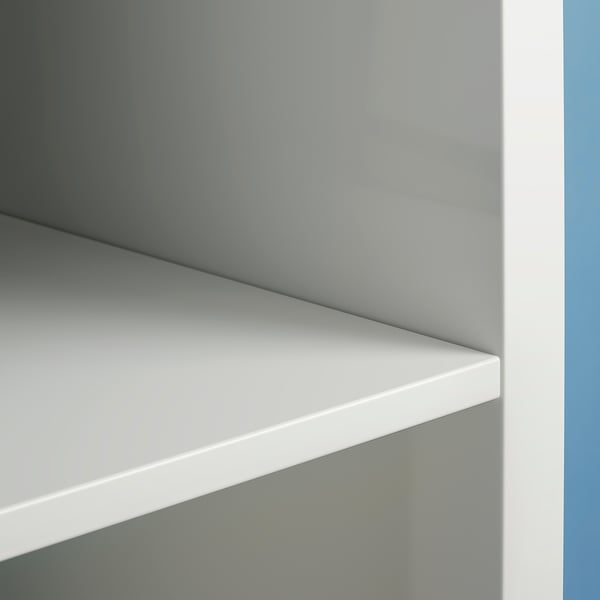 White KALLAX shelf unit detail. Smooth, modern design with clean lines and minimalist style.