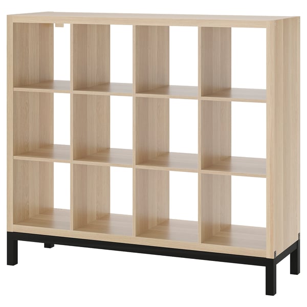 An ikea KALLAX light brown cubed shelf, featuring a metal base, providing a modern and organized storage solution.