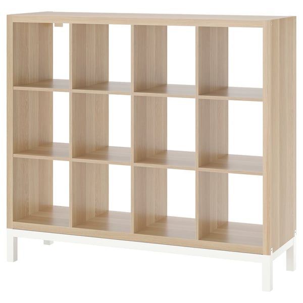KALLAX light oak bookshelf, 12 cubicles, particleboard and steel, 4 white legs, airy design.