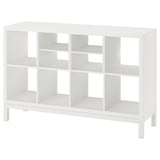 White ikea KALLAX shelving unit for storage. Minimalist design with cubes and steel frame.