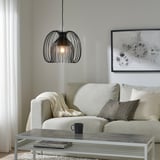 Modern living room with beige sofa, KALLFRONT lamp, gray coffee table, abstract art, minimalist decor.