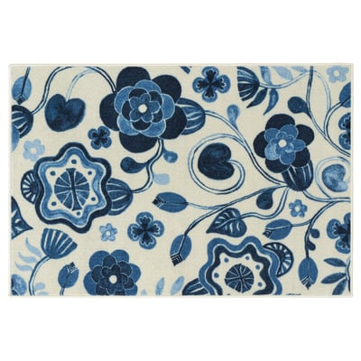 KANTLINJE rug, light beige with blue floral pattern, rectangular, plush, decorative.