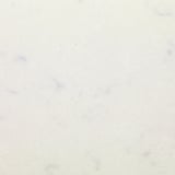 Smooth, light-colored quartz surface with minimal speckles, showcasing high-quality finish suitable for kitchen or bar tops.