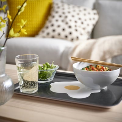 KEJSARFISK black tray holds bowl, glass, & dish. Rectangular, strong melamine. Fits well on table near couch.