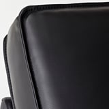 Close-up of KIVIK sofas high-quality leather, smooth texture, and neat stitching.