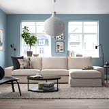 Living room with KIVIK sofa, coffee table, pendant lamp, and city views.