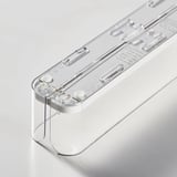 Transparent plastic drink holder, quality design with adjustable sides, neatly organizes cans/bottles.