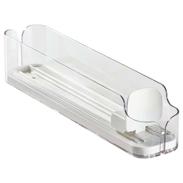 A clear plastic KLIPPKAKTUS drink holder, designed to organize cans and bottles in a fridge. It adjustable sides and a front opening for easy access.