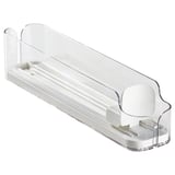 A clear plastic KLIPPKAKTUS drink holder, designed to organize cans and bottles in a fridge. It adjustable sides and a front opening for easy access.