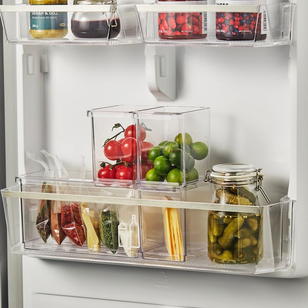 Fridge organizers store fruits, veggies, and pickles, maximizing space with clear, stackable boxes for easy access.