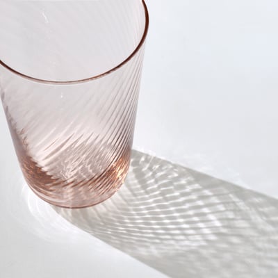 KLIPPLAX clear glass tumbler, sleek & thin, smooth exterior, textured interior, elegant design.