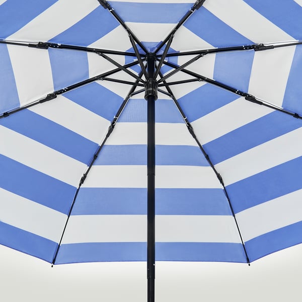 Blue and white striped umbrella open, showcasing sturdy black metal frame and handles, striped pattern neatly aligned.