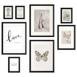Eight black-framed pictures arranged in a gallery wall layout. Topics include ballet, butterflies, and inspirational quotes.