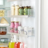 Fridge with clear organizer bins: stores jars, bottles, and food neatly.