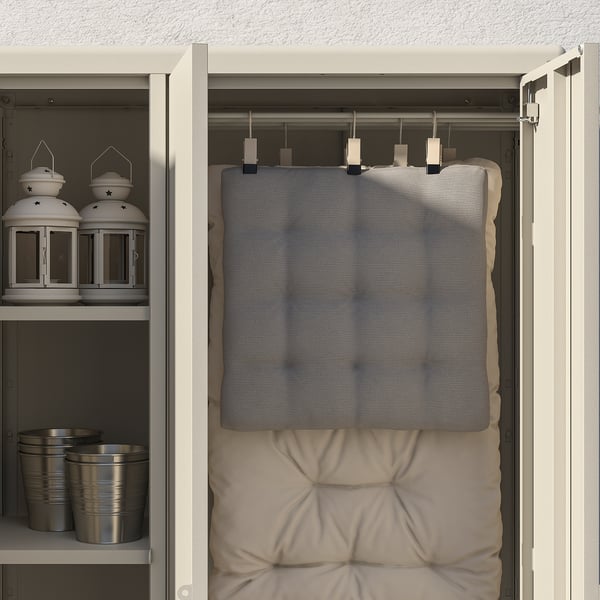 Open closet showing KOLBJÖRN. Hangs cushions, stores jars, lanterns. Sturdy, adjustable, indoor/outdoor.