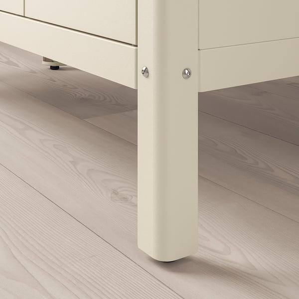 Close-up of ikea KOLBJÖRN storage units sturdy, powder-coated steel leg with adjustable foot on light wooden floor.