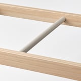 Modern wooden clothes rail detail, showcasing high-quality finish & sturdy design.