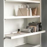Closet shelf with handbags and jewelry. Or for a more concise version: closet shelf with bags and jewelry.