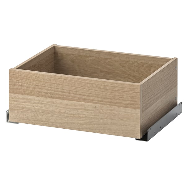 Ikea KOMPLEMENT wooden drawer, light brown, minimalist design with metal glides for clothes and accessories.