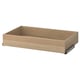 An ikea KOMPLEMENT drawer in light oak color. Its rectangular with light wood grain texture, featuring metal runners for smooth operation.