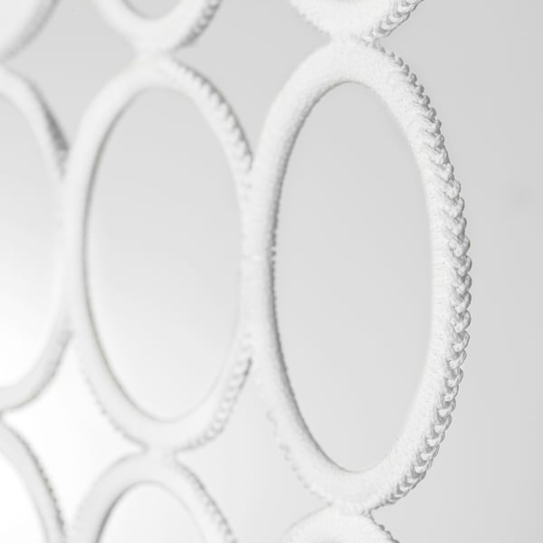 KOMPLEMENT hanger close-up, showcasing intricate design and durable materials with braided loops.