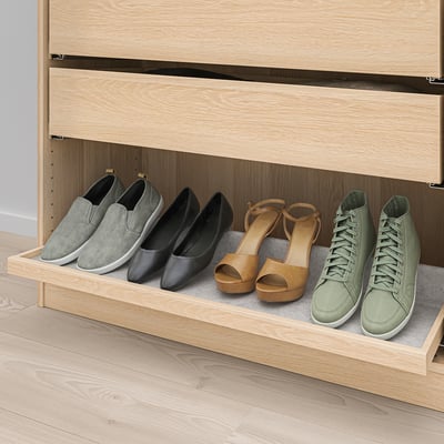 Wooden shoe rack with four pairs of shoes: gray slip-ons, black flats, tan heels, and green sneakers, featuring pull-out tray for easy access.