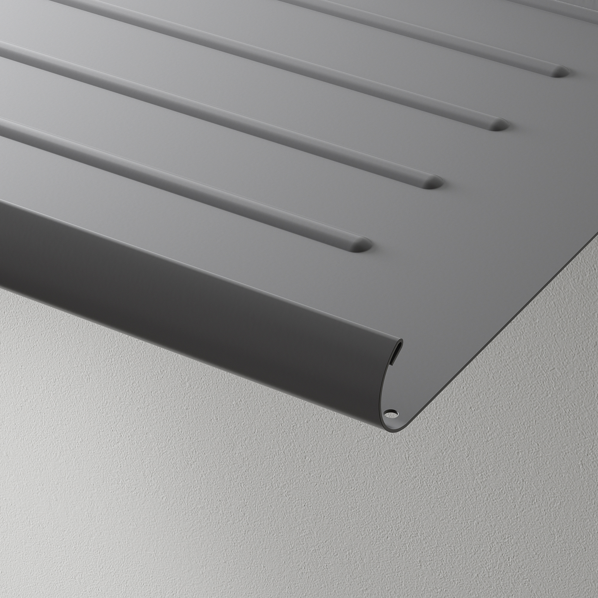 Modern, metallic gray shelf with slanted design and chamfered edge, perfectly displayed against a clean wall.