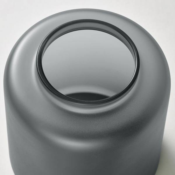 Sleek, modern glass vase with smooth, glossy finish. Wide opening allows easy flower arrangement. Mouth-blown craftsmanship ensures unique design.
