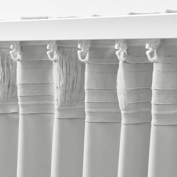 White KORGMOTT curtains, gunslinger hooks attached, textured woven fabric, block-out design.