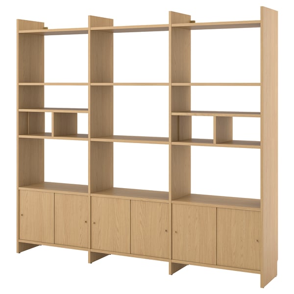 Light oak LÅDMAKARE storage system, featuring open shelves for display and enclosed cabinets for storage, designed with a sleek, minimalist aesthetic.