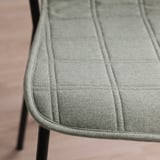 Modern conference chair with sleek, cushioned seat, horizontal stitching for comfort, and sturdy metal legs.