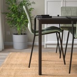 Modern conference setup: stackable chairs with removable covers, rubber armrests, and lumbar support.