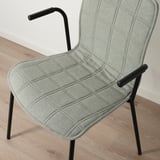 Modern, ergonomic chair with padded seat and back. Black metal armrests and legs. Light gray fabric cover.