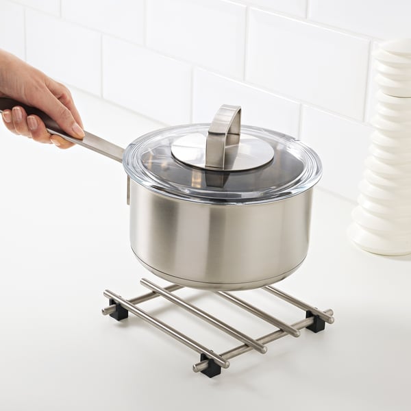 Hand with ladle on stand
