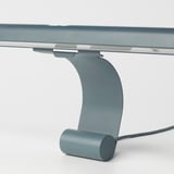 Modern blue led lamp clips to screen, providing soft, adjustable light. Magnetic attachment for easy positioning.