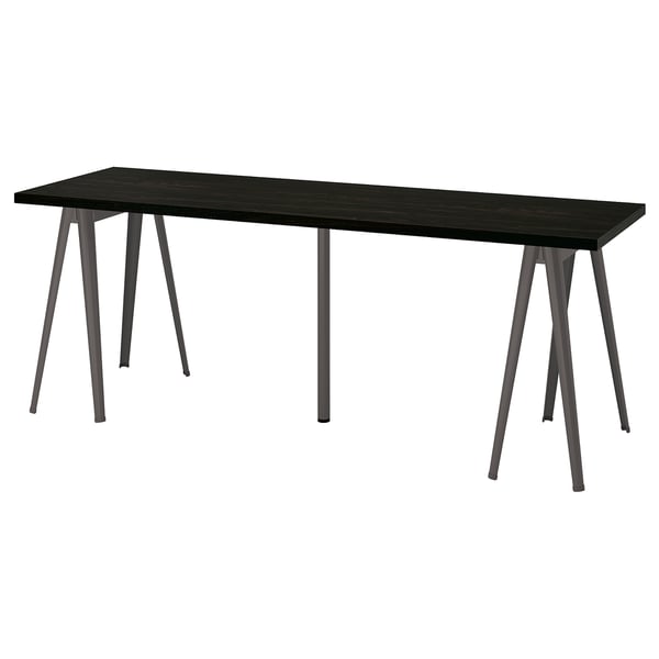 A LAGKAPTEN desk with a dark brown top and metallic legs, featuring a sleek rectangular design.