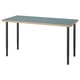 A LAGKAPTEN desk in blue with a honeycomb-patterned edge. It has adjustable black metal legs.