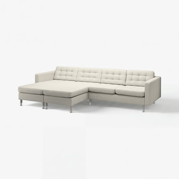 Modern grey l-shaped sofa, tufted cushions, chrome legs.