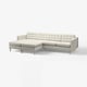 Modern grey l-shaped sofa, tufted cushions, chrome legs.