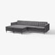 Modern grey sectional couch: three cushioned seats, tufted back, chrome legs.