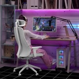 Gaming setup with LÅNESPELARE arm, vr user, led lights, action game, white pc.