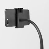 A black smartphone holder attached to a flexible stand, securely gripping a phone. Ideal for video streaming.