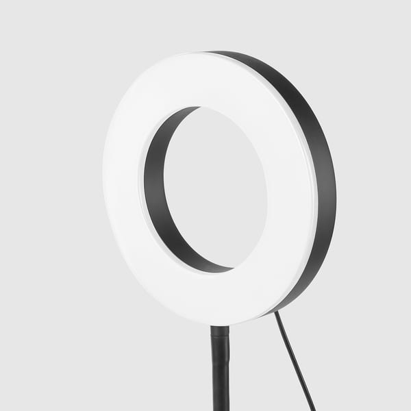 A sleek, modern ring light with a 360° adjustable stand and phone holder for optimal lighting and positioning.