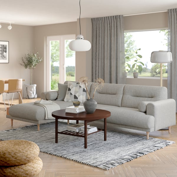 Modern living room with grey LÅNGARYD sofa, coffee table, and large windows.